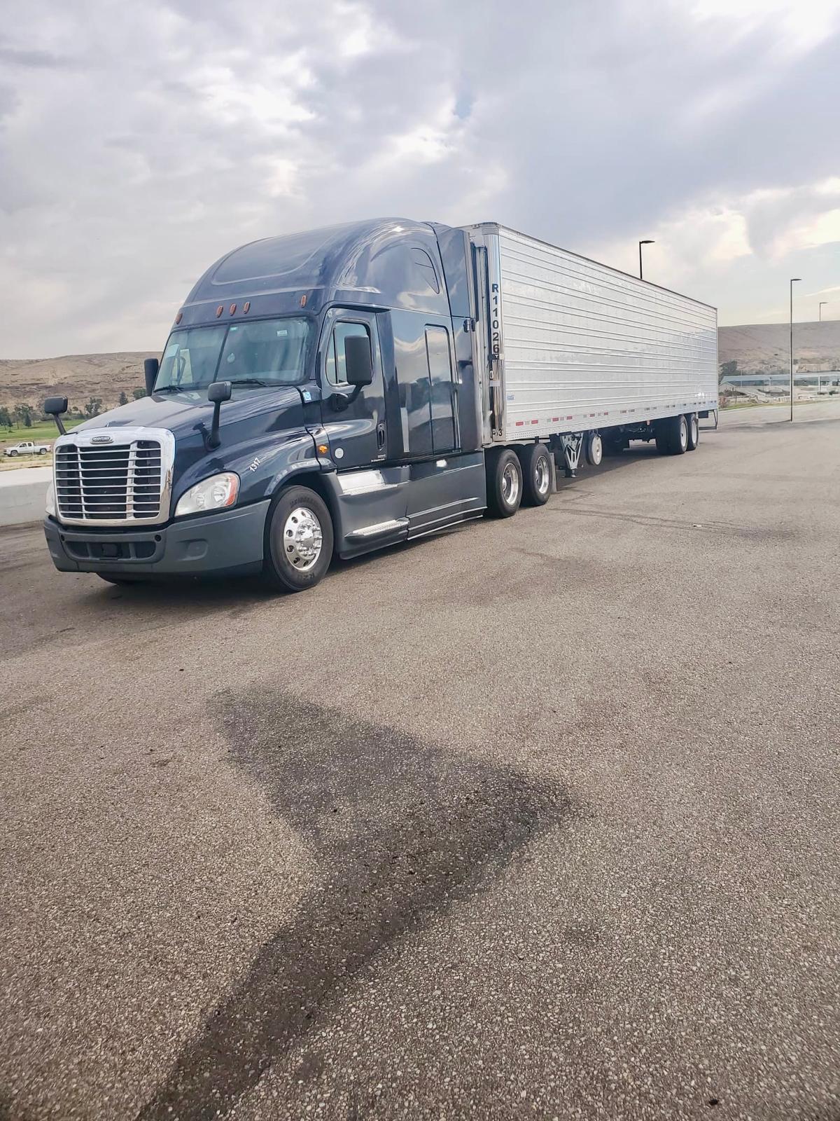 Veteran-owned freight tractor coupled to a refrigerated trailer