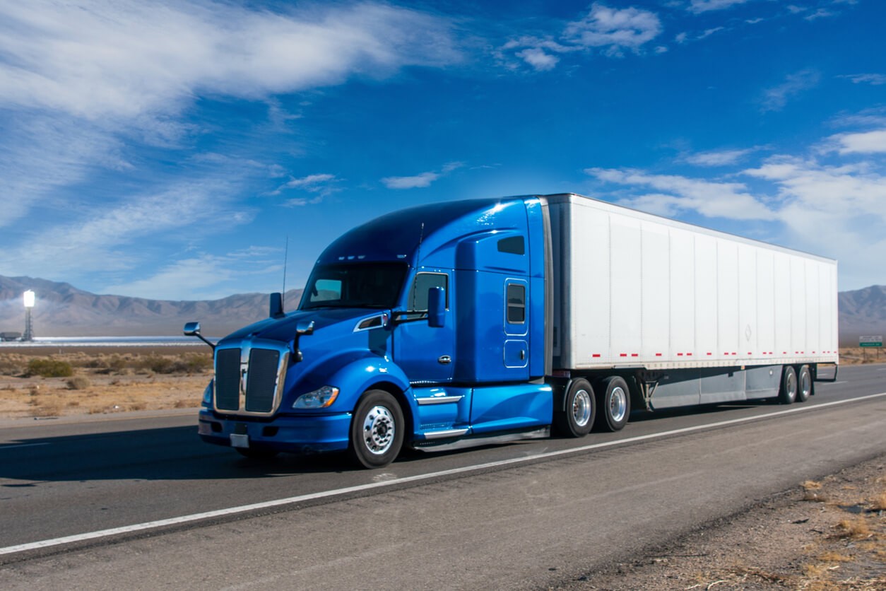 US Veteran Logistics tractor-trailer running an open interstate at speed
